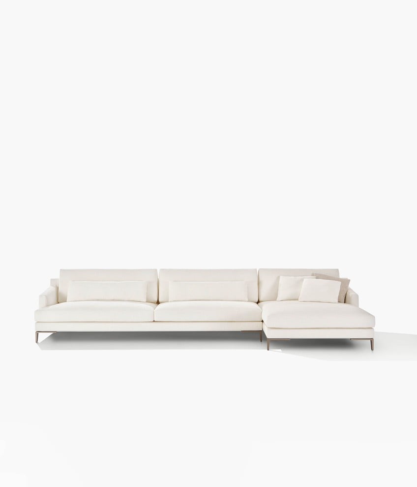 Bellport sofas with low armrest, removable cover in fabric Olimpia 58 bianco, cushion in fabric Skyros 02 sabbia, lower back cushions in fabric Olimpia 58 bianco, feet in mat champagne.