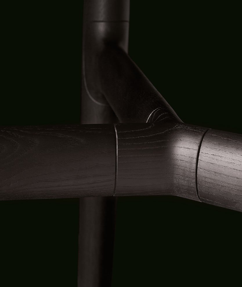 Detail of the structure of the Curve table with black elm crosspiece.
