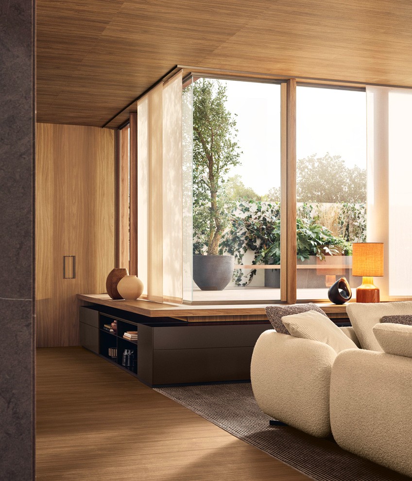 Code storage units with open compartments in bronze lacquer finish, drawers and side panels in semi-gloss visone lacquer finish, backlit top in bronze lacquer finish and lower profile with matt slate finish. Saint-Germain sofa in white Siro fabric (01) with removable covers, cushions in chocolate Brest fabric (11), burnt ochre Persia velvet (2020) and cream Glasgow velvet (01). Legs with Brown Nickel matt nickel finish. Cannelè carpet.
