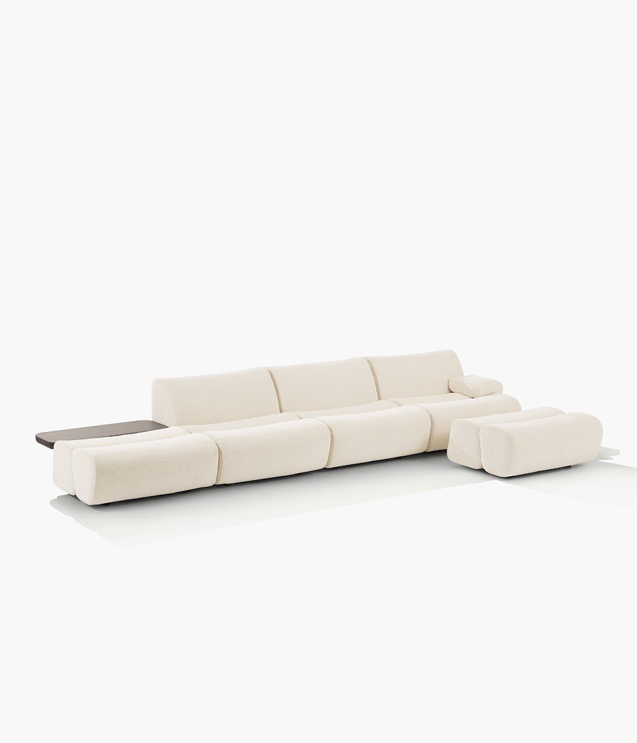 Ernest sofa with removable cover in velvet Glasgow 01 crema, behind sofa coffee table in black elm.
