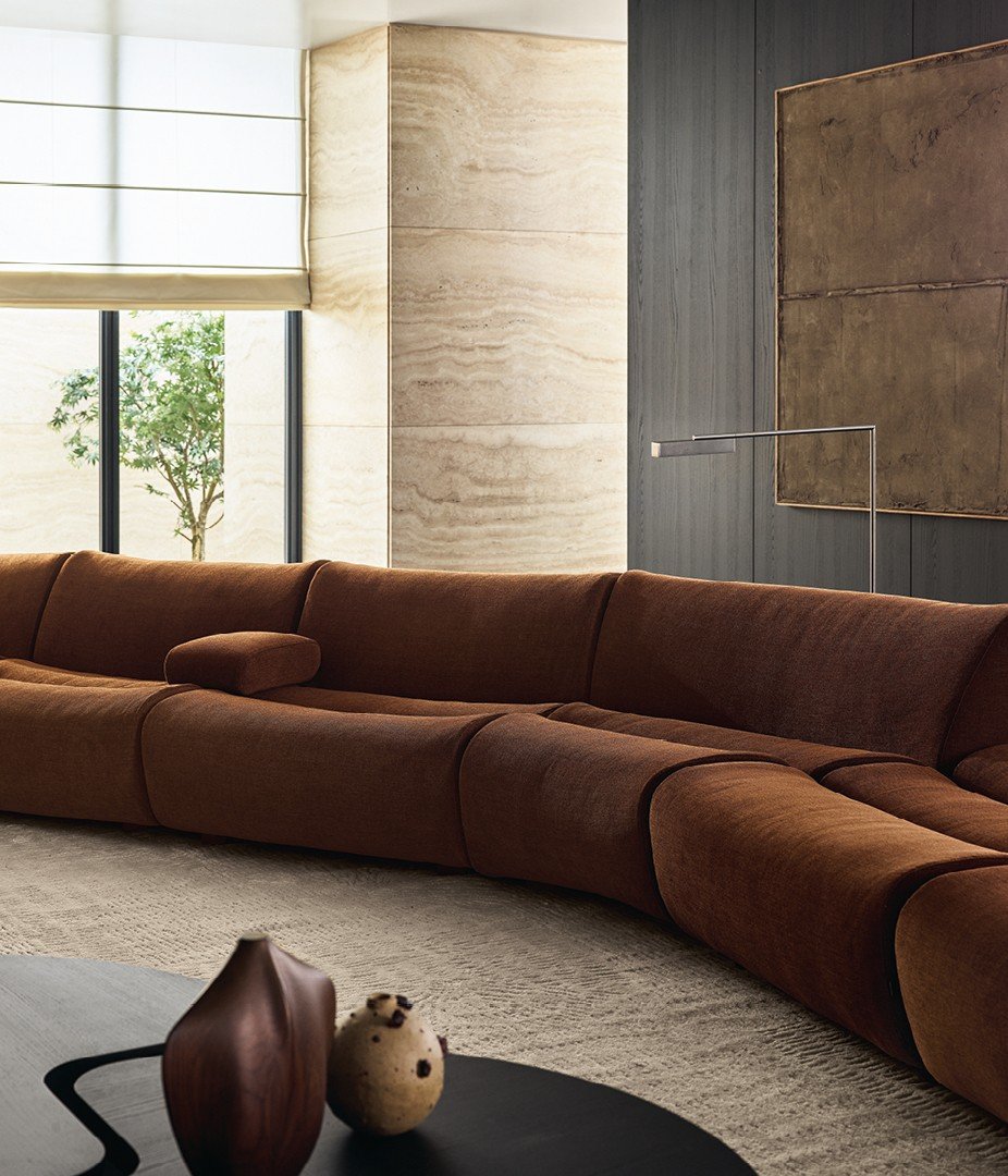 Close up of the armrest positioned between two elements of the sofa.