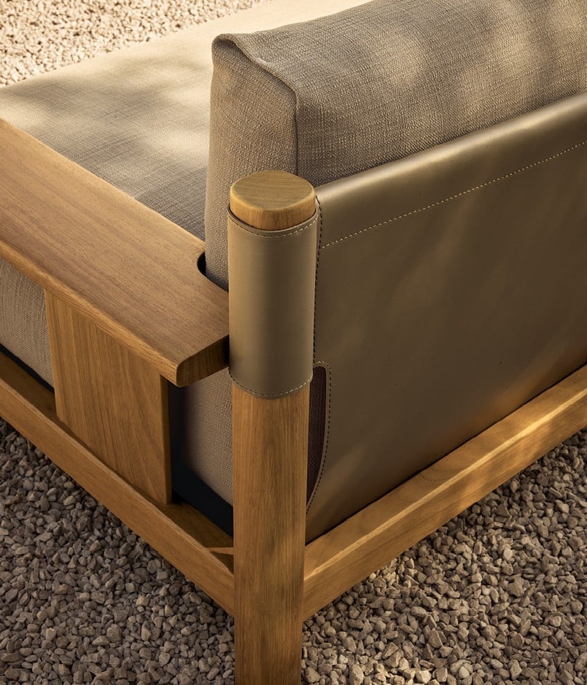 Ketch sofa with structure in solid teak and backrest in EVA oliva, removable cover in fabric Karif 03 sabbia with decorative drawstring stitching, lower back cushions in fabric Karif 03 sabbia and Ghibli 04 sabbia.