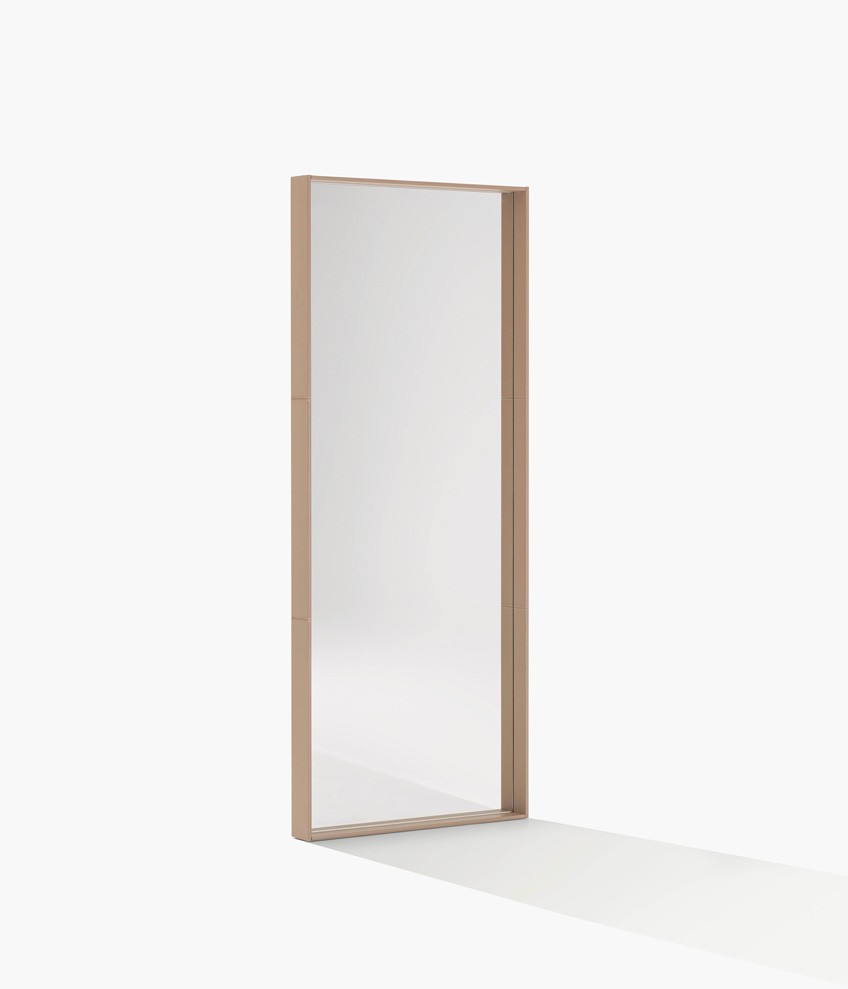 Sara mirror with frame in hide 29 tortora, visible stitching and white mirror.