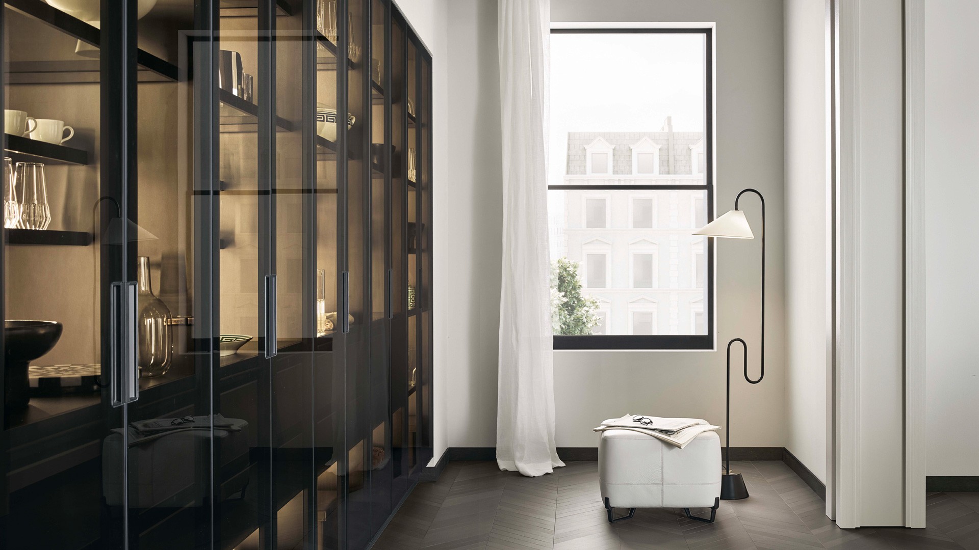 Tall units PR22 with fumé glass doors, black anodized profile and integrated black painted handle.
