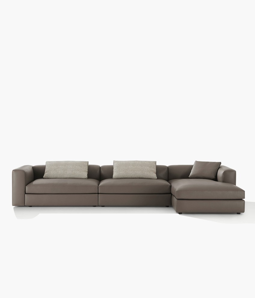 Dune sofa with removable cover in leather Soft 07 roccia, cushions in fabric Sendai 02 tortora and leather Soft 07 roccia with border in grosgrain nero.