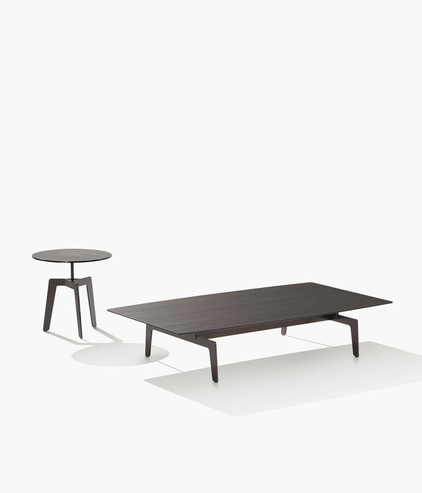 Tribeca rectangular coffee table with structure in mat brown nickel and top in black elm, round version with structure in glossy brown nickel and top in glossy marble noir saint laurent.